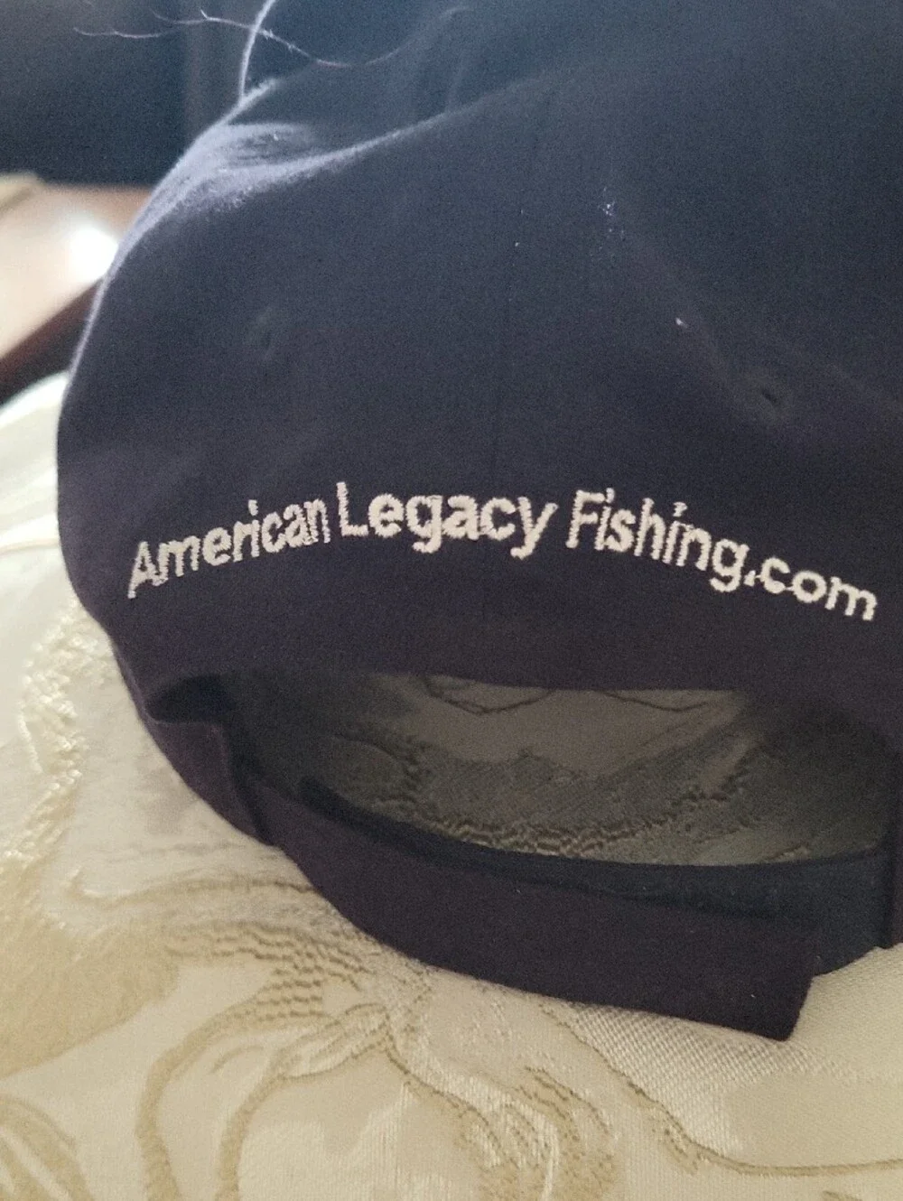 Black Baseball Cap with White Fish Skeleton Logo